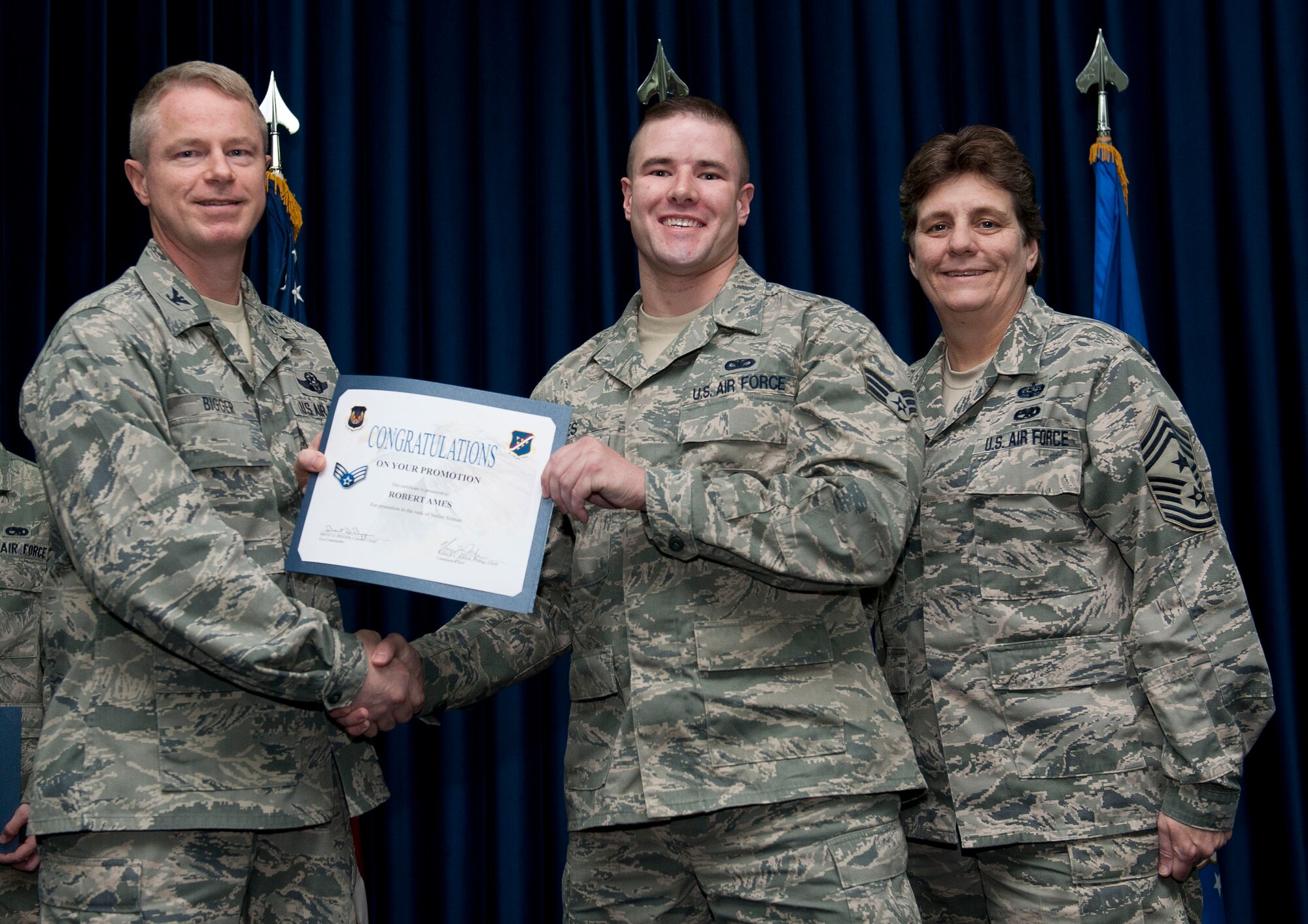 Robert Ames, 39th Security Forces Squadron, is promoted to the rank of senior airman Nov. 30, 2012, at the club complex ballroom at Incirlik Air Base, Turkey. (U.S. Air Force photo by Senior Airman Clayton Lenhardt/Released)