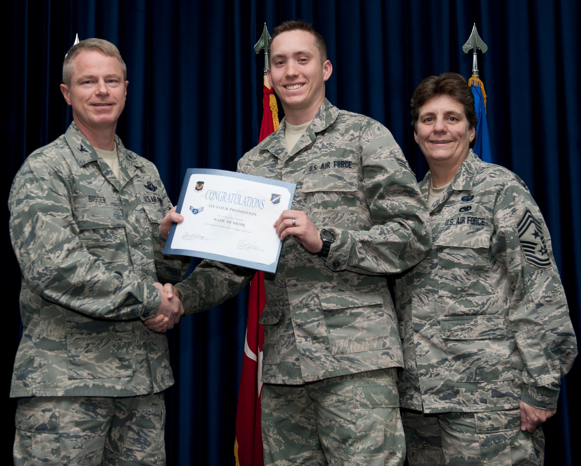 Wade McBride, 39th Medical Support Squadron, is promoted to the rank of airman first class Nov. 30, 2012, at the club complex ballroom at Incirlik Air Base, Turkey. (U.S. Air Force photo by Senior Airman Clayton Lenhardt/Released)