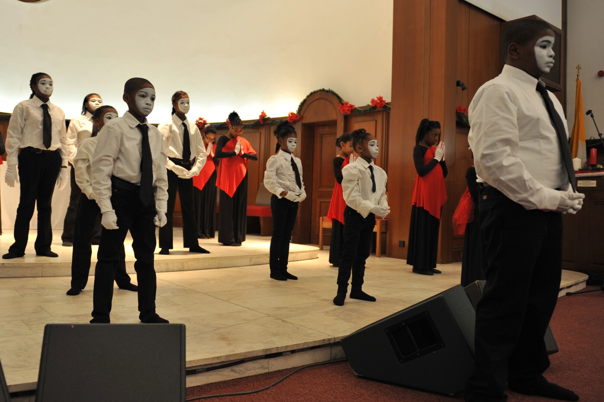 Children of the Vogelweh Gospel Service Youth Praise Dance and Mime Ministry perform at the Vogelweh Christmas Tree Lighting Ceremony at the Vogelweh Chapel on Kapaun Air Station, Germany, Nov. 29, 2012. The tree lighting was used to kick off the Christmas holiday season. (U.S. Air Force photo/Airman 1st Class Holly Cook)