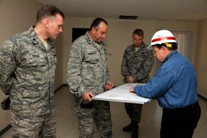 Gen. Philip M. Breedlove, U.S. Air Forces in Europe and U.S. Air Forces Africa commander, receives a briefing about the current base housing renovation project from Tommy Rose, U.S. Army Corps of Engineers, Nov. 29, 2012, at Incirlik Air Base, Turkey. The project will modernize more than 300 homes on base as part of a six-year housing construction initiative. (U.S. Air Force photo by Tech. Sgt. Dallas Edwards/ Released)