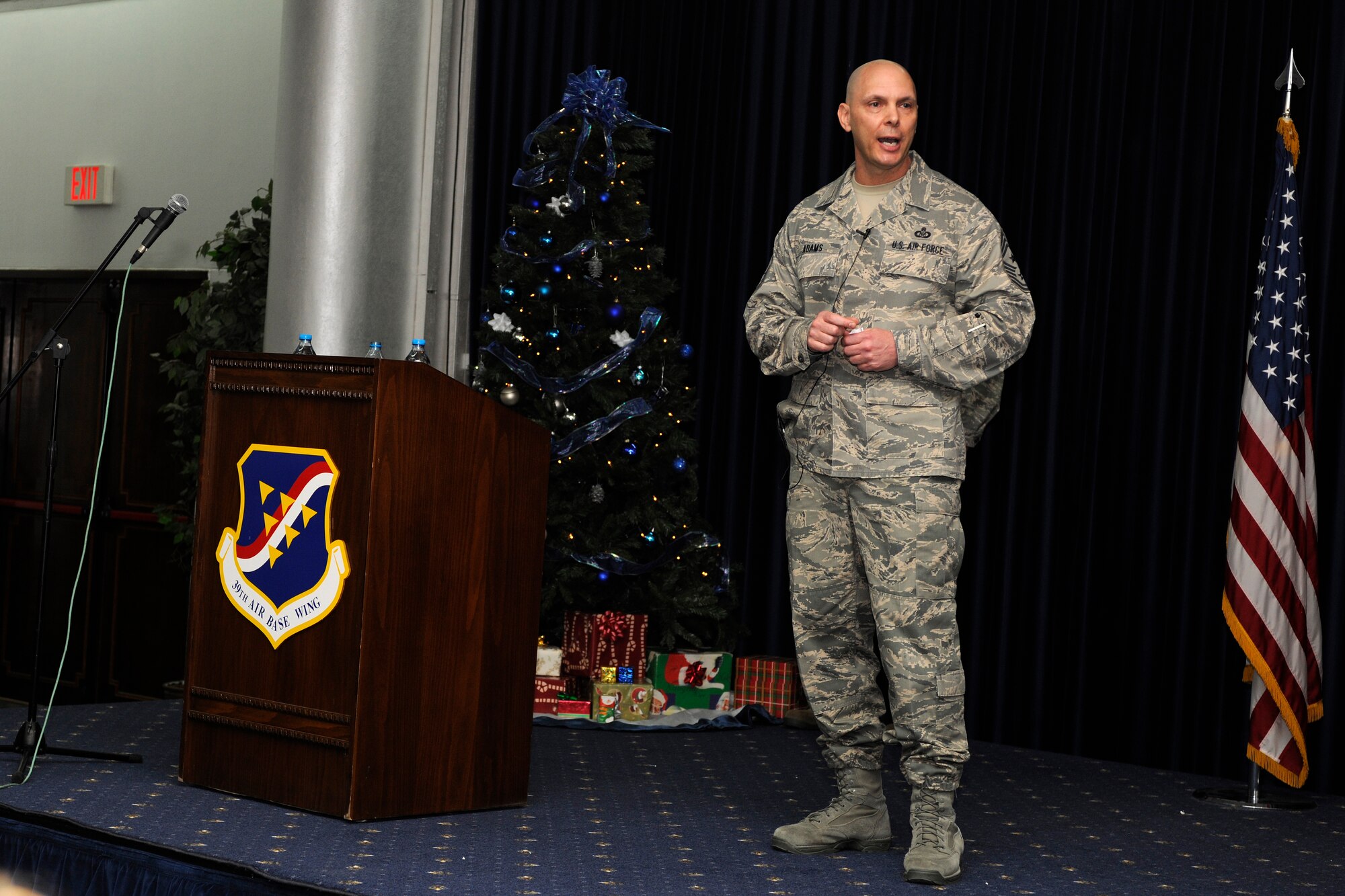 Chief Master Sgt. Craig A. Adams, United States Air Forces in Europe and U.S. Air Forces Africa command chief, addresses Incirlik Airmen at the club complex during an all call Nov. 29, 2012, at Incirlik Air Base, Turkey. Adams discussed looking out for the well-being of all Airmen and the importance of the United States’ relationship with Turkey. (U.S. Air Force photo by Tech. Sgt. Dallas Edwards/ Released)