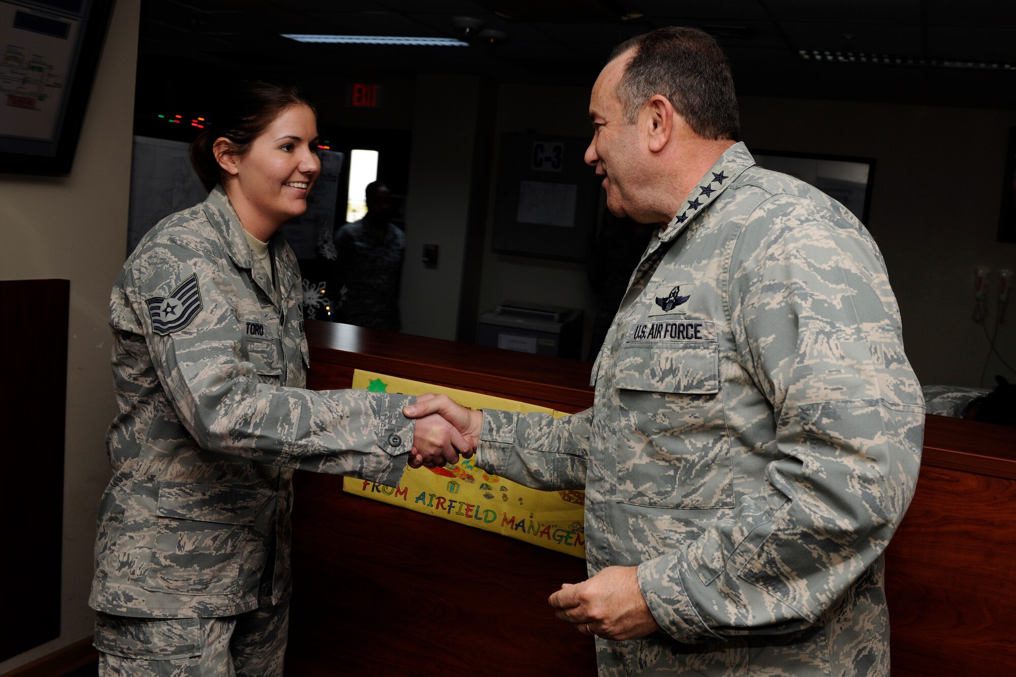 Tech Sgt. Lisa Toro, 39th Operations Squadron NCOIC of airfield management operations, receives a coin from Gen. Philip M. Breedlove, U.S. Air Forces in Europe and U.S. Air Forces Africa commander, Nov. 28, 2012, at Incirlik Air Base, Turkey. Toro was singled out by her leadership to receive recognition for her outstanding performance and professionalism. (U.S. Air Force photo by Tech. Sgt. Dallas Edwards/ Released)