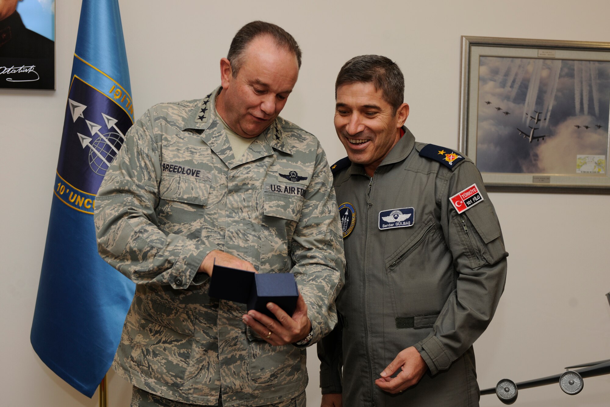 Gen. Philip M. Breedlove, U.S. Air Forces in Europe and U.S. Air Forces Africa commander, presents a gift to Turkish Air Force Brig. Gen. Serdar Gulbas, 10th Tanker commander, Nov. 28, 2012, at Incirlik Air Base, Turkey. During his visit, Breedlove praised the professionalism and skills of the Turkish Air Force and expressed the importance of a strong relationship with the 39th Air Base Wing’s Turkish hosts. (U.S. Air Force photo by Tech. Sgt. Dallas Edwards/ Released)