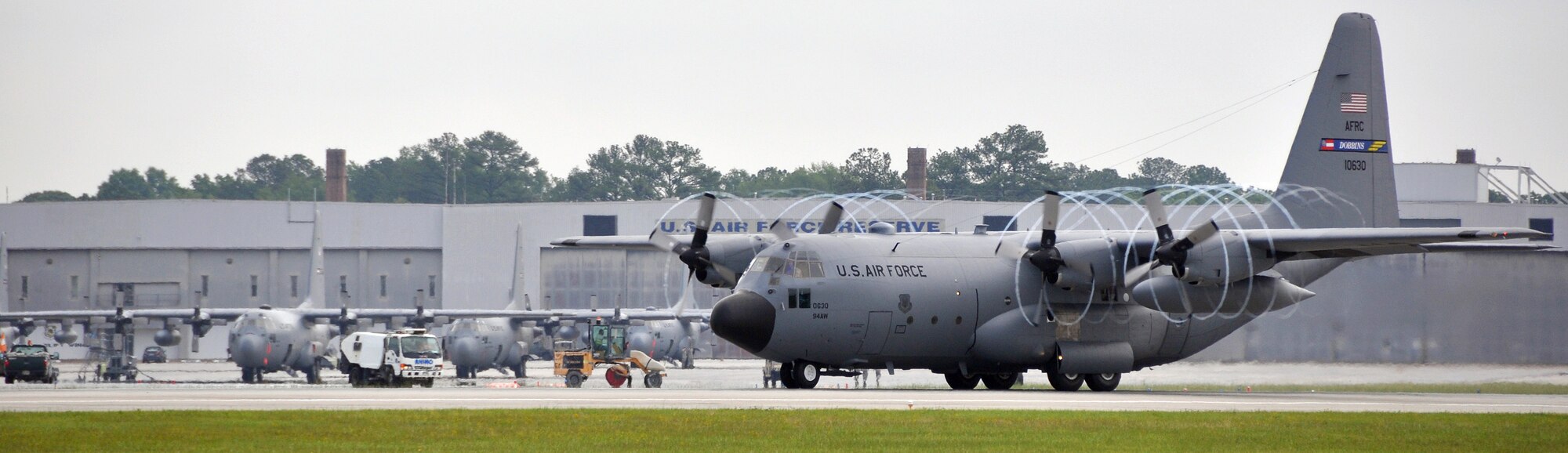 C-130 of the 94th Airlift Wing taking off from Dobbins Air Reserve Base during a send-off ceremony on May 4.  Members of the 94th Airlift Wing deployed in support of operations in the Middle East. (U.S. Air Force photo/Airman 1st Class Elizabeth Gaston)