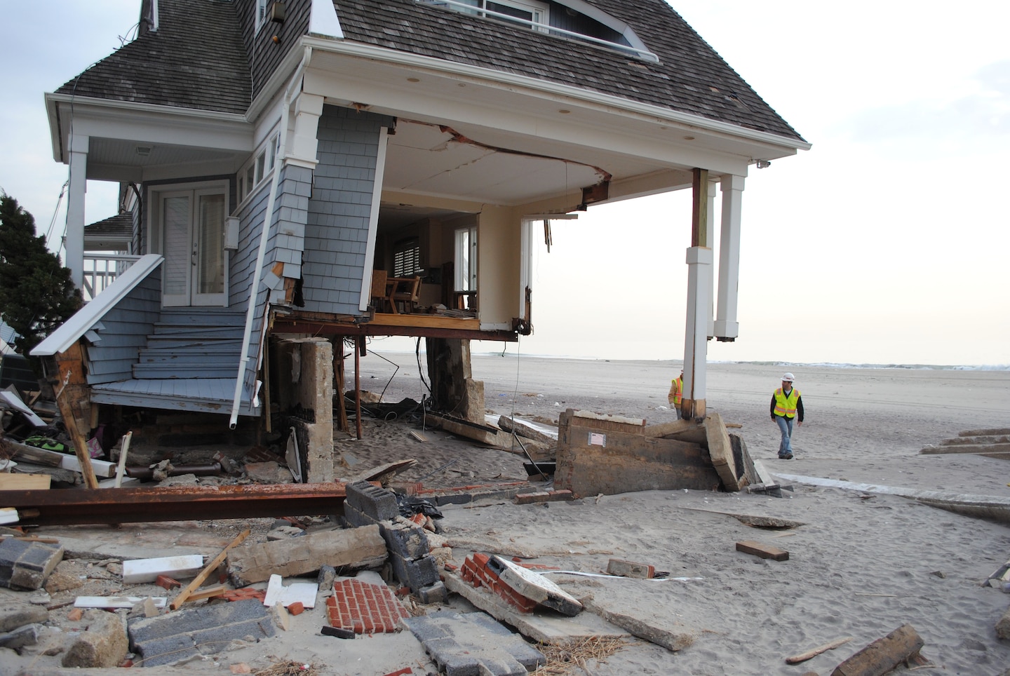 Jay Hershey, a debris engineer with the U.S. Army Corps of Engineers New York Recovery Field Office, inspects a house, devastated by last month's Hurricane Sandy, in Queens, N.Y., Nov. 30.