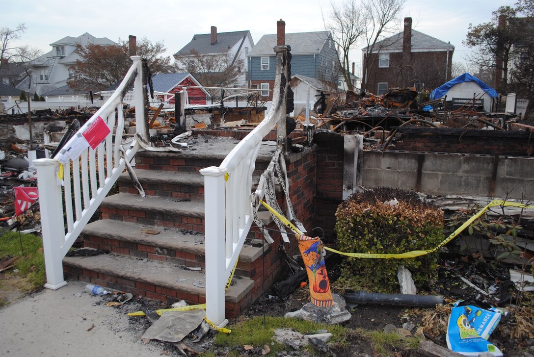 Only the steps and piles of burned debris remain of Martha Militano's home following last month's Hurricane Sandy. Fifteen of Militano's neighbors also lost homes on Beach 130th Street in the Rockaways in Queens, N.Y.