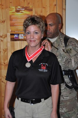 Karen Anderson, deployed to the Afghanistan Engineer District-South from March 2009 to December 2012, was presented the Steel de Fleury Medal Nov. 21 by Afghanistan Engineer District-South Commander Col. Vincent Quarles.