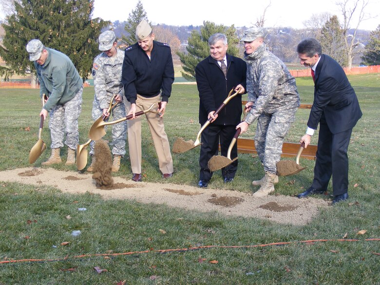 Leaders from the Defense Logistics Agency and U. S. Army Corps of Engineers break ground for the new DLA headquarters building at the Defense Distribution Susquehanna, Pa., on Nov. 28. They include (from left) Col. David Touzinsky, commander, Defense Distribution Susquehanna; Army Brig. Gen. Susan Davidson, Commanding General, DLA Distribution Center; Vice Adm. Mark Harnitchek, Director, Defense Logistics Agency; William Budden, Senior Executive Service, deputy commander; Col. Kent Savre, commander, U.S. Army Corps of Engineers, North Atlantic Division, and Rob Montefour, DLA Installation Support site director.
