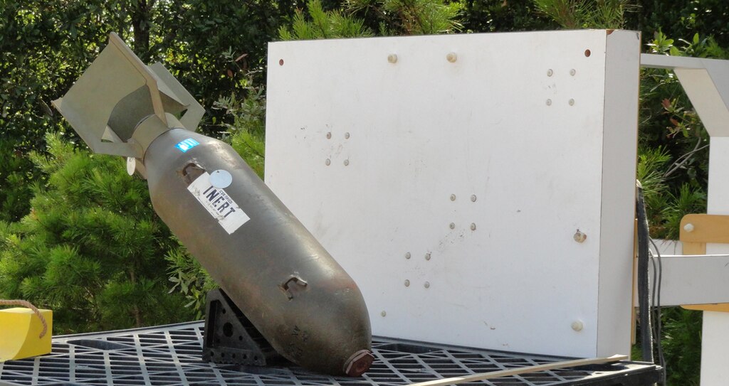 The MetalMapper sensor is turned on its side to collect advanced electromagnetic induction signatures on an inert, 100-pound general purpose bomb. The bomb, now a museum piece, provides a data signature for those used in the 1940s.
