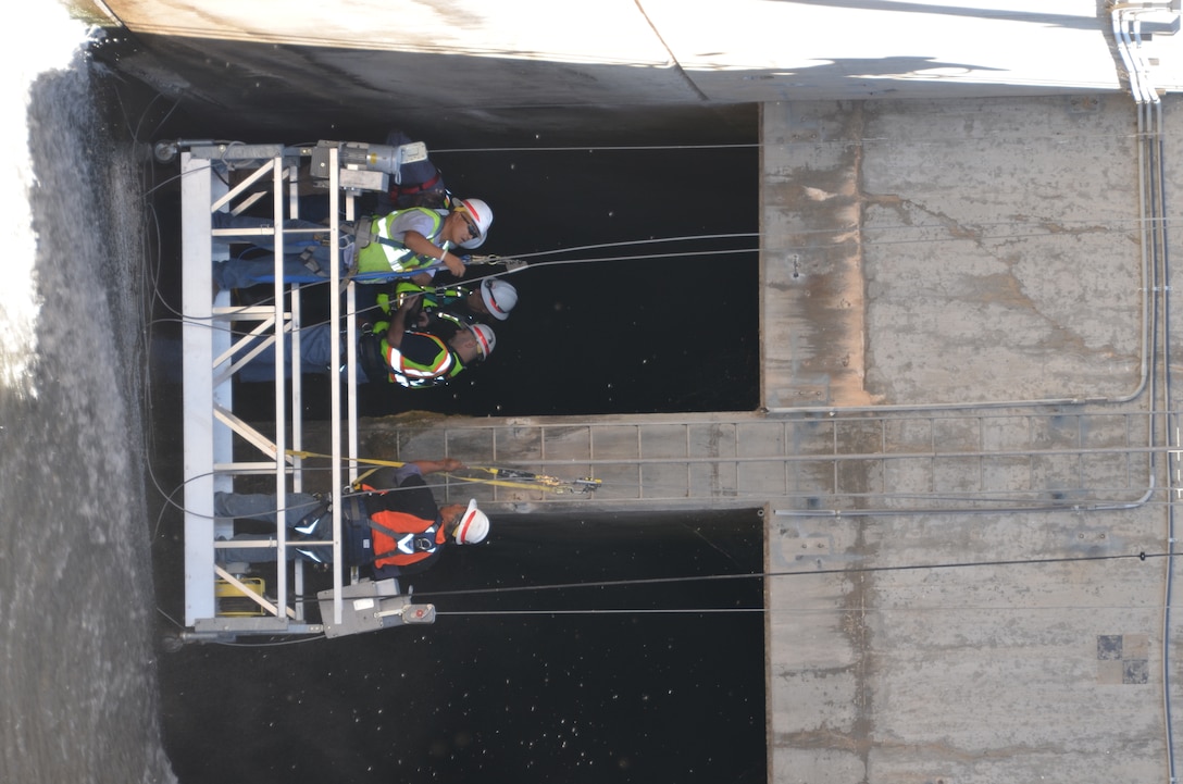COCHITI DAM, N.M., -- OCA team members thoroughly inspect the dam.