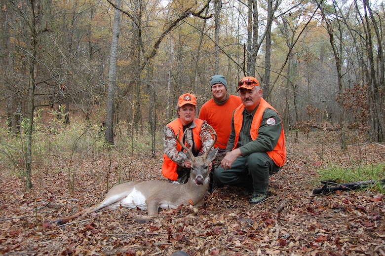 (L to R) Wounded Warrior Army Master Sgt. Regina Leatherman harvested this 8-point buck during Millwood lakes first Wounded Warrior hunt. Engineering Tech Michael Stoke and Forester Roy Burk assisted hunters throughout the hunt. Rangers from the Little Rock District, Millwood Lake Project Office coordinated the event with local sponsors who provided jackets, knives and food for the hunters. 