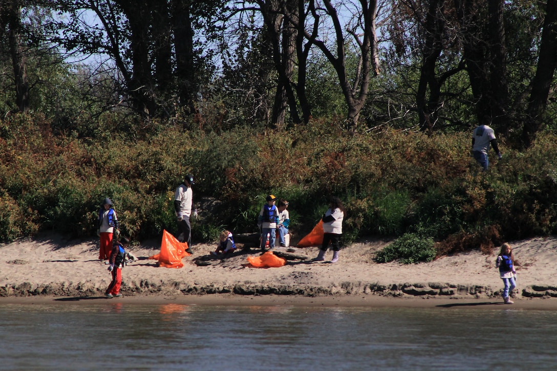 Volunteers for the Missouri River Relief Cleanup event, held Septmber 22 north of Omaha, Neb., were provided life jackets and a boat ride on the river where they were let out on the banks of the Big Muddy to discover what happens to trash when it hits the watershed.