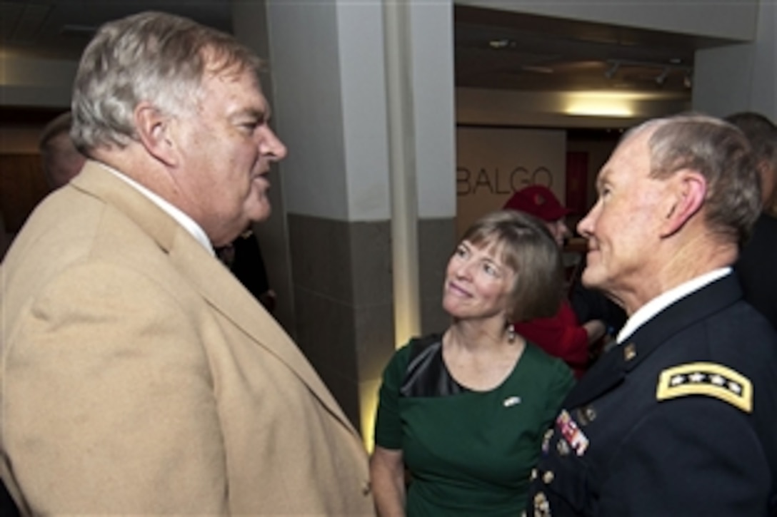 Army Gen. Martin E. Dempsey, right, chairman of the Joint Chiefs of Staff, and his wife, Deanie, center, speak with Australian Ambassador to the U.S. Kim Beazley, left, during a dinner hosted by the Australian Embassy to honor a group of wounded warriors and their families in Washington, D.C., Nov. 30, 2012. 