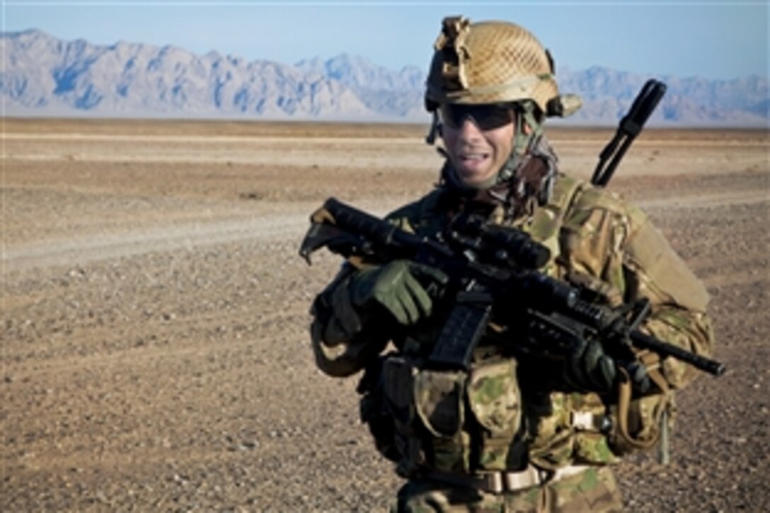 A coalition force member maintains security during a patrol in Afghanistan's Farah province, Nov. 25, 2012. 