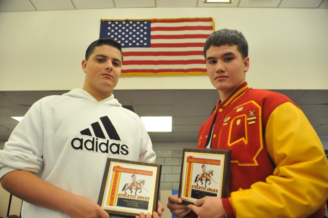Erik, 11th grade, and Alec, 11th grade, stand proudly with their awards during the Quantico Middle/High School Fall Athletic Awards assembly at the school, Nov.14.  Both Erik and Alec were the named the most valuable players on the varsity football team. 