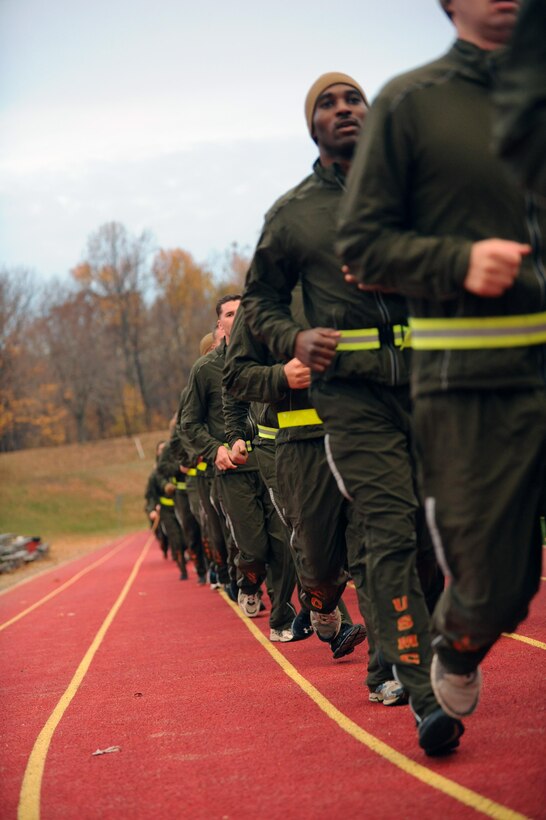 Marines from Headquarters and Service Battalion kick off their battalion Toys for Tots run at Butler Stadium on Friday. The run helped to raise awareness for the Toys for Tots program that delivers a new toy to children at Christmas.