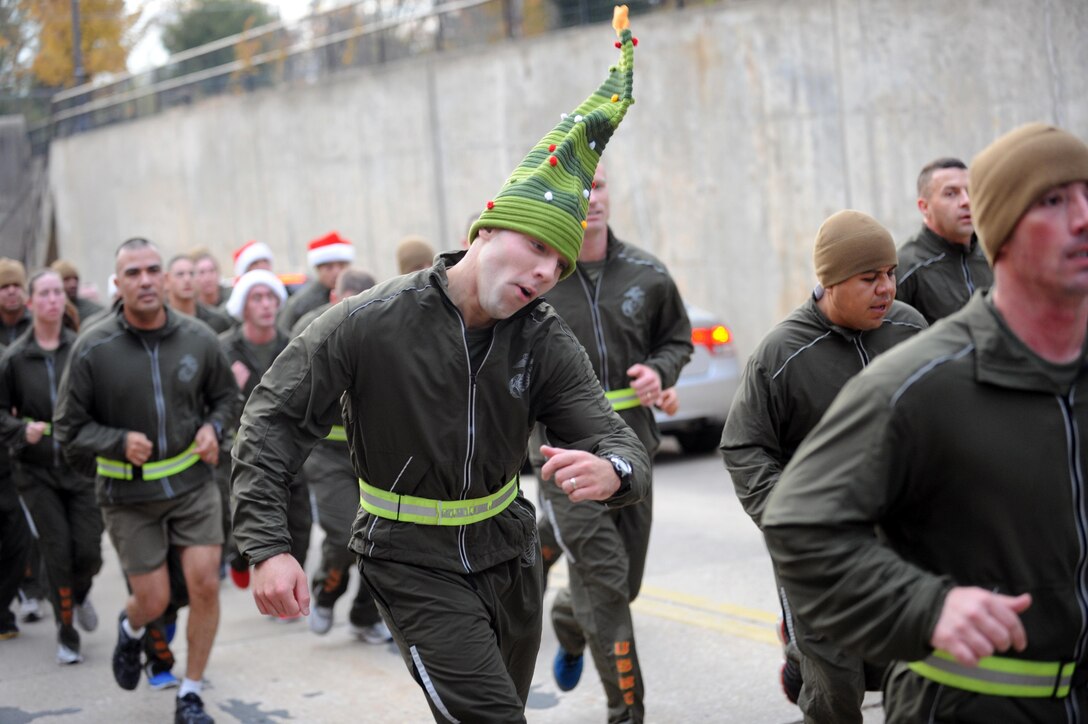Capt. Joseph W. Hardin, executive officer, Headquarters Company, Headquarters and Service Battalion runs during the Headquarters and Service Battalion’s Toys for Tots run on Friday. The battalion ran to raise awareness for the Toys for Tots program.