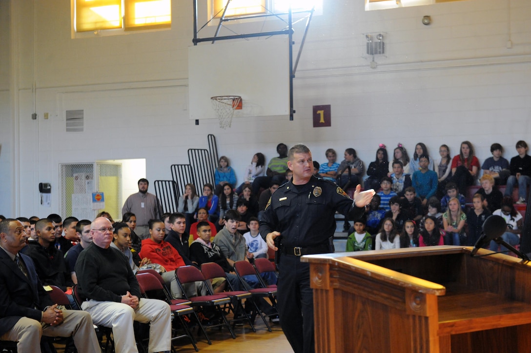 Joseph P. Riley, Marine Corps Base Quantico chief of police spoke on the legal actions that can be taken with bullying during the bullying prevention seminar presented by community members, faculty members and students in the Quantico Middle/High School gymnasium on Friday. Riley let students know that the punishment they could receive from bullying would not only affect their lives now but in the future as well. 