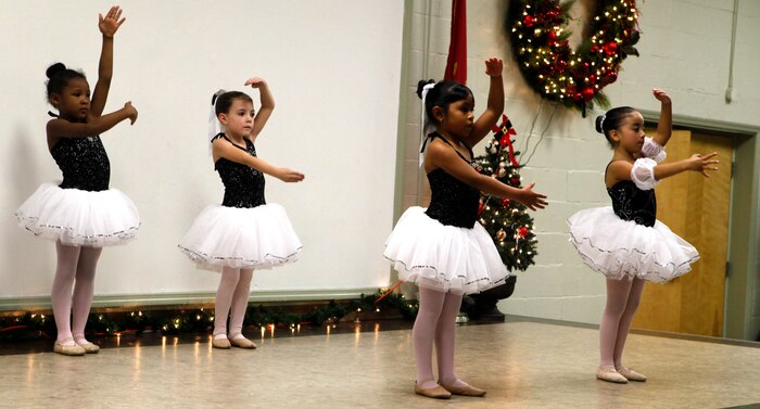 Four little ballerinas perform during the Tarawa Terrace Community Center Holiday Tree Lighting Ceremony at the Marine Corps Base Camp Lejeune housing community center Dec. 1. Young dancers from the community center’s Dance With Me Academy provided entertainment for the event’s patrons throughout the evening.