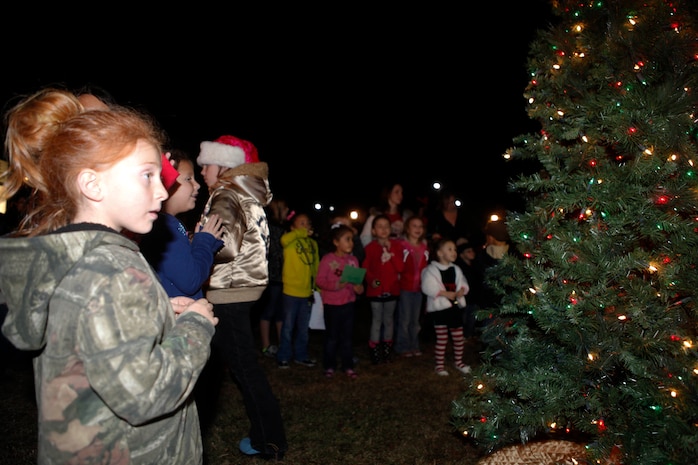 Two young dancers perform with candy-cane props during the Tarawa Terrace Community Center Holiday Tree Lighting Ceremony at the Marine Corps Base Camp Lejeune housing community center Dec. 1. Young entertainers from the community center’s Dance With Me Academy provided pleasant diversions from the winter chill for the event’s patrons throughout the evening.