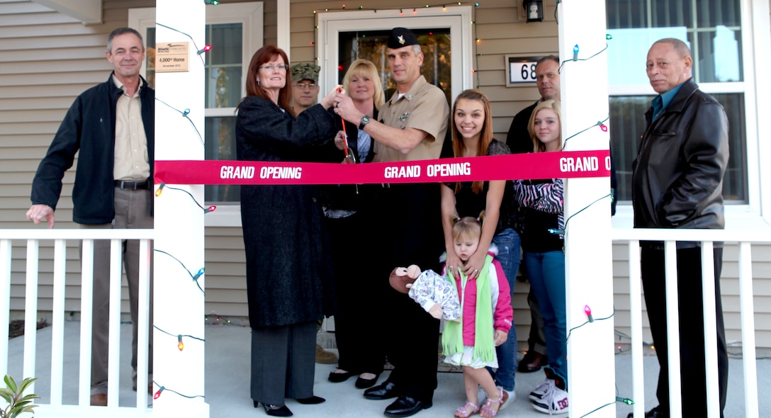 The Pancost family was welcomed to their new home, the 4,000th built by Atlantic Marine Corps Communities, by leaders from Marine Corps Base Camp Lejeune, base housing and AMCC Nov. 29. Their new home is in the staff noncommissioned officer enclave in Knox Landing.