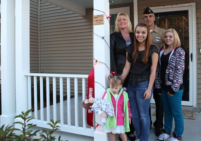 The Pancost family was welcomed to their new home, the 4,000th built by Atlantic Marine Corps Communities, by leaders from Marine Corps Base Camp Lejeune, base housing and AMCC Nov. 29. Their new home is in the staff noncommissioned officer enclave in Knox Landing.