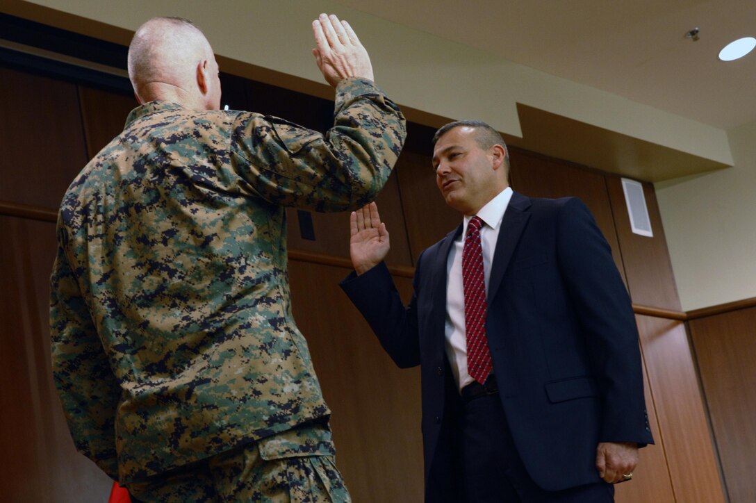 Lt. Gen. Steven A. Hummer, commander Marine Forces Reserve and Marine Forces North, swears in Gregg T. Habel to the position of executive director of MARFORRES and MARFORNORTH Dec. 3, during a ceremony at Marine Corps Support Facility New Orleans.  Habel’s new duties as the executive director will include providing strategic leadership and management to MARFORRES and MARFORNORTH and ensuring efficient management of resources in order to optimize operational capability. (U.S. Marine Corps Photo by Cpl. Nana Dannsa-Appiah/Released)    