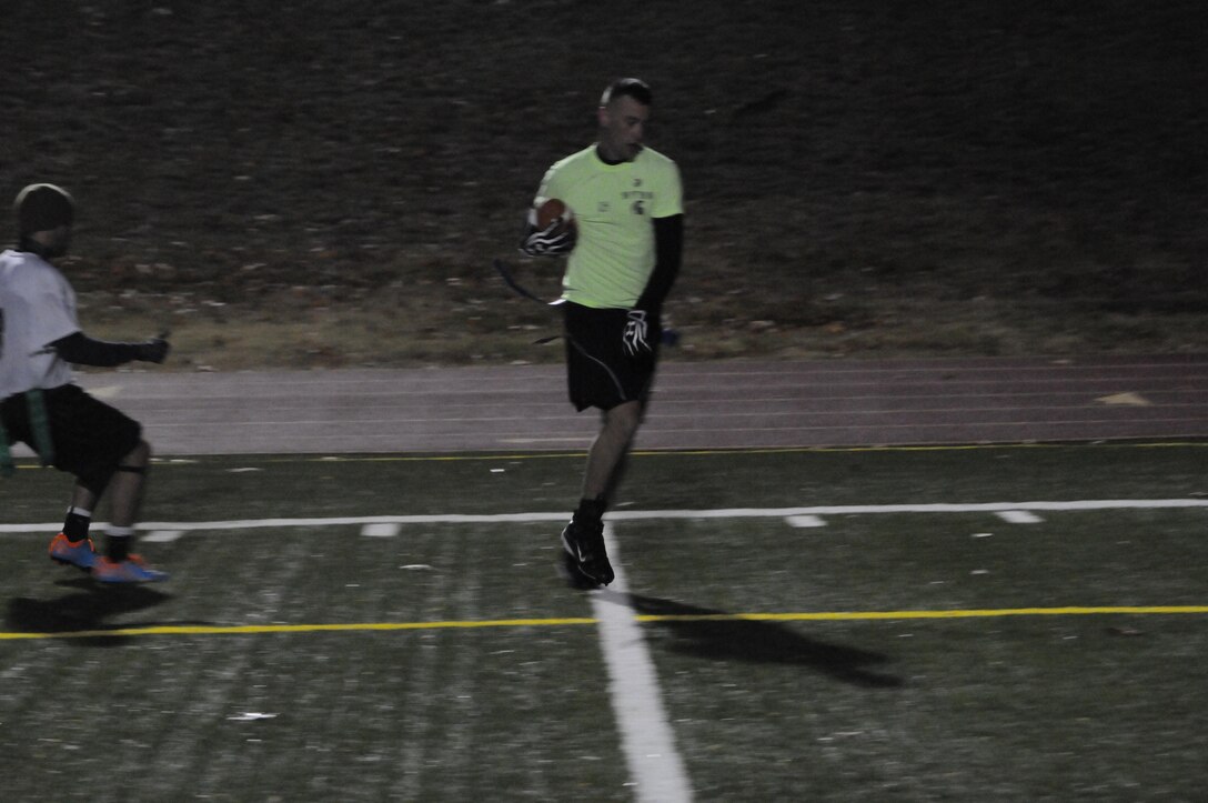 A player for Weapons Training Battalion’s flag football team strolls into the end zone during the final game of the season Marine Corps Intelligence Activity at Butler Stadium on Nov. 27. The final score of the game was WTBN 26, MCIA 7.