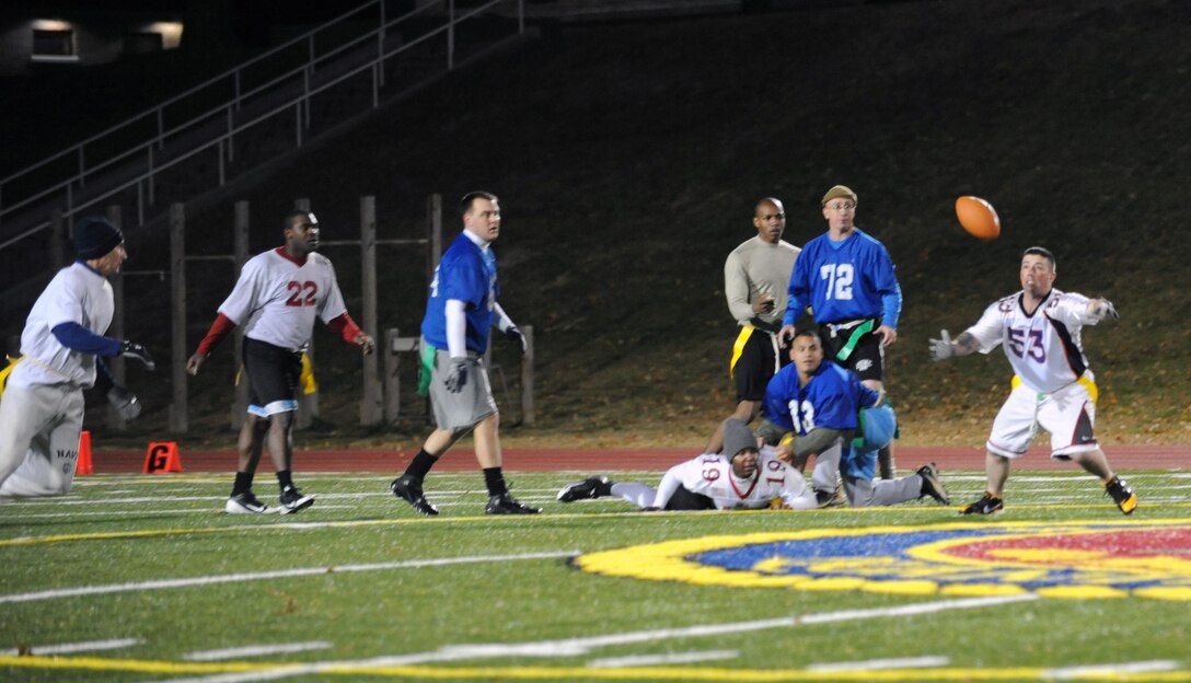 Timothy Nettles, player for Headquarters and Service Battalion Demons, dives for a fumble during the intramural flag football game against Marine Corps Helicopter Squadron One on Nov. 15 at Butler Stadium.