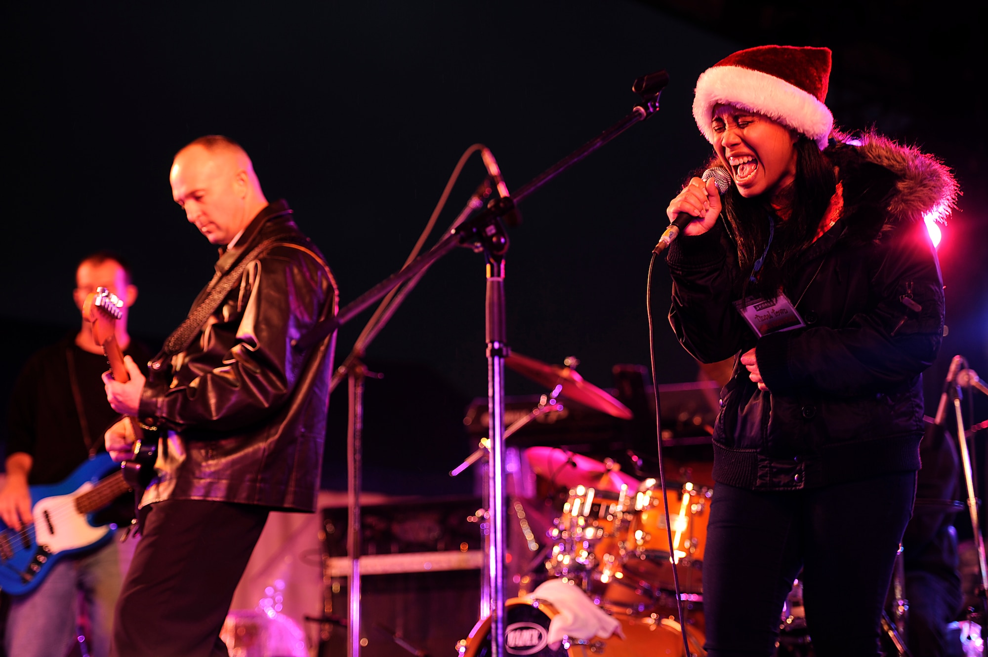 Rock band 9 Long Lives performs during the Tinsel Town holiday festival on Kadena Air Base, Japan, Dec. 1, 2012. Despite dark skies and a constant Okinawan drizzle in the air, the event gave a merry light to the crowd with games, children's rides, concessions, prize giveaways and concerts by several bands including country music star Trace Adkins during his USO tour. (U.S. Air Force photo/Senior Airman Maeson L. Elleman)