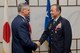 YOKOTA AIR BASE, Japan -- U.S. Air Force Lt. Gen. Sam Angelella, U.S. Forces Japan and 5th Air Force commander, congratulates Japan Air Self-Defense Force Lt. Gen. Masayuki Hironaka, Air Support Command commander, JASDF, after he receives The Legion of Merit during the ceremony at Yokota Air Base, Japan, Dec. 4, 2012. (U.S. Air Force photo by Osakabe Yasuo)