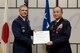 YOKOTA AIR BASE, Japan -- (left to right) U.S. Air Force Lt. Gen. Sam Angelella, U.S. Forces Japan and 5th Air Force commander, presents The Legion of Merit to Japan Air Self-Defense Force Lt. Gen. Masayuki Hironaka, Air Support Command commander, JASDF, at Yokota Air Base, Dec. 4, 2012. Hironaka demonstrated superb leadership in support of humanitarian assistance and disaster relief operations following the aftermath of the Great East Japan earthquake and tsunami disaster. His immediate implementation of bilateral operational coordination measures with U.S. Forces directly resulted in the efficient execution of search and rescue, nuclear disaster response, and disaster relief operations. (U.S. Air Force photo by Osakabe Yasuo)