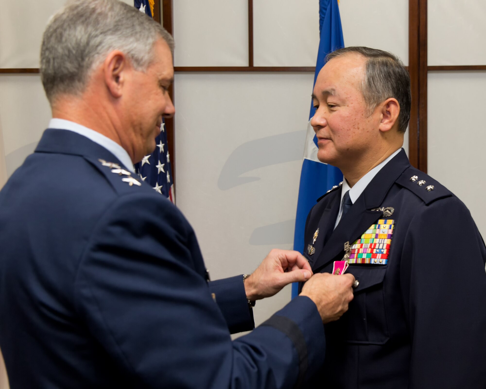 YOKOTA AIR BASE, Japan -- Japan Air Self-Defense Force Lt. Gen. Masayuki Hironaka, Air Support Command commander, receives The Legion of Merit medal pinned by U.S. Air Force Lt. Gen. Sam Angelella, U.S. Forces Japan and 5th Air Force commander, at Yokota Air Base, Dec. 4, 2012. Hironaka received the award for meritorious conduct, performance and achievement during bilateral disaster relief operations following the aftermath of the Great East Japan earthquake and tsunami last year. The Legion of Merit is awarded to members of armed forces of friendly foreign nations who have distinguished themselves by exceptionally meritorious conduct in the performance of outstanding service. (U.S. Air Force photo by Osakabe Yasuo)