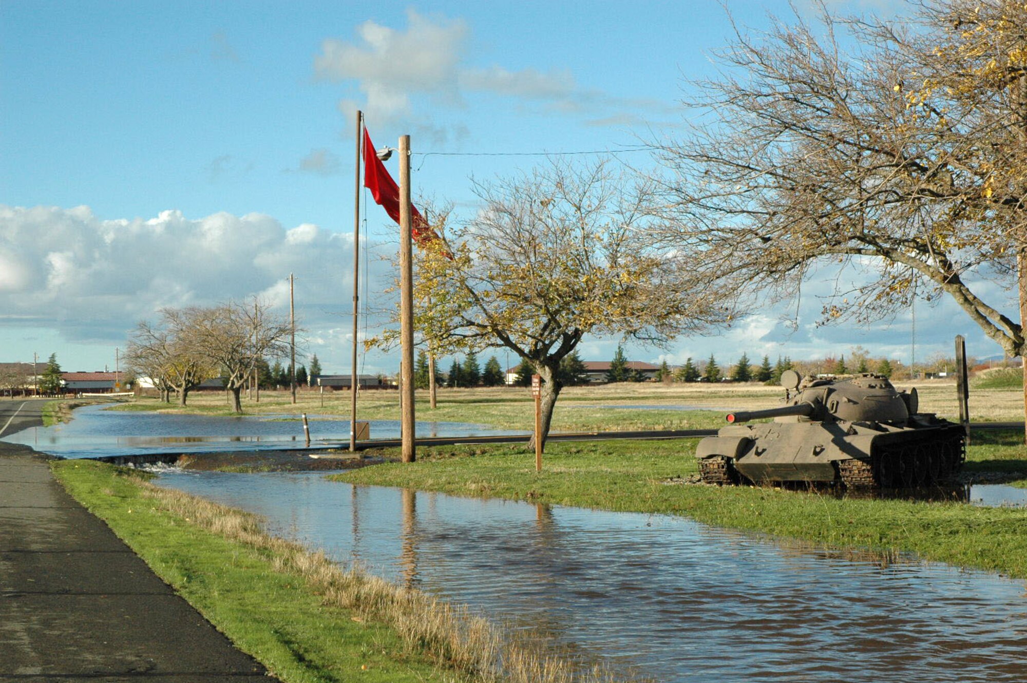 As the sky cleared, flood waters continued to spill over the entrance to the CATM range on Beale AFB, Calif. Dec 2. During the flood the 940th Security Forces diverted traffic from flooded roads and secured areas where power lines had fallen. (U.S. Air Force photo/Dana Lineback)