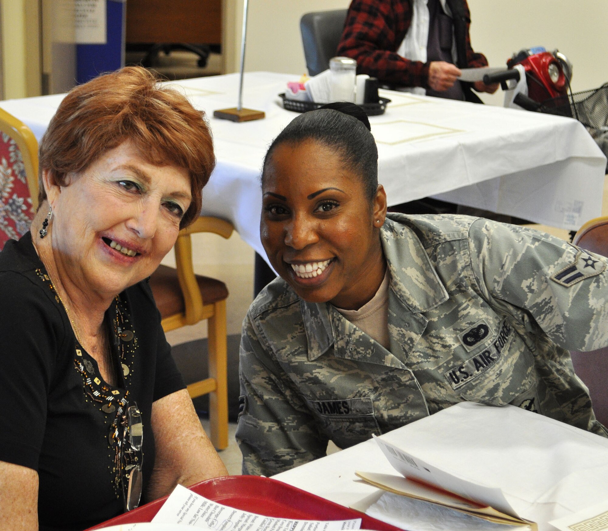 TRAVIS AIR FORCE BASE, Calif. -- Airmen from the 349th Air Mobility Wing "Give Thanks' by serving dinner to these veterans who have paved the way for the military we have today. Along with their friends and family, they share fellowship and a scrumptious turkey dinner with the men and women who, happily, shared there military stories and experiences.  (U.S. Air Force photo / Senior Master Sgt. Ellen Hatfield) 