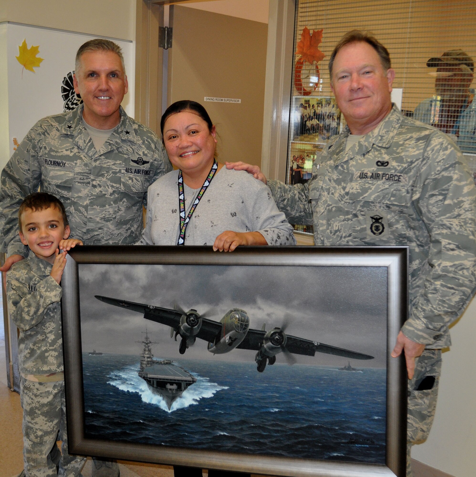 TRAVIS AIR FORCE BASE, Calif. -- Airmen from the 349th Air Mobility Wing "Give Thanks' by serving dinner to these veterans who have paved the way for the military we have today. Along with their friends and family, they share fellowship and a scrumptious turkey dinner with the men and women who, happily, shared there military stories and experiences.  (U.S. Air Force photo / Senior Master Sgt. Ellen Hatfield) 