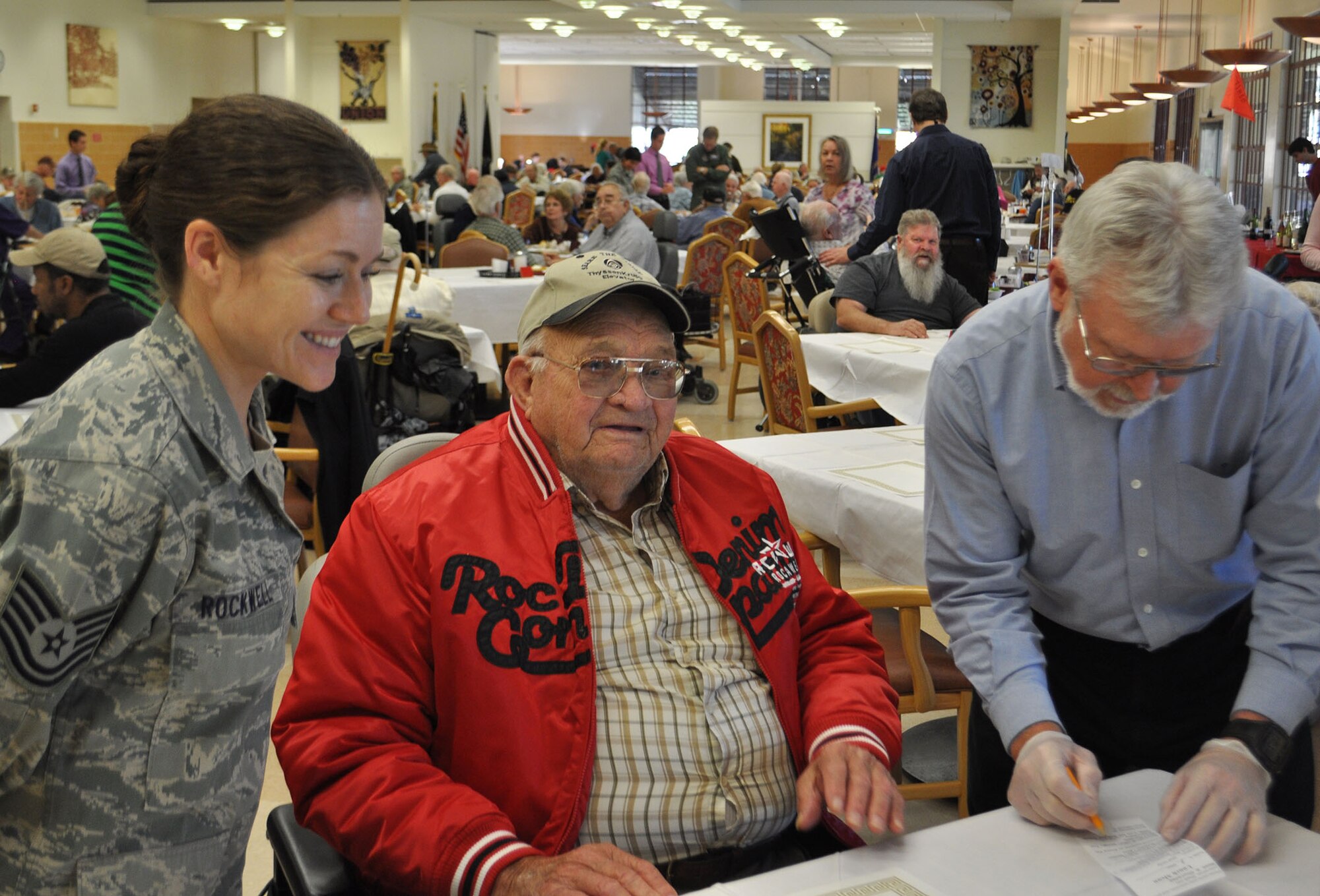 TRAVIS AIR FORCE BASE, Calif. -- Airmen from the 349th Air Mobility Wing "Give Thanks' by serving dinner to these veterans who have paved the way for the military we have today. Along with their friends and family, they share fellowship and a scrumptious turkey dinner with the men and women who, happily, shared there military stories and experiences.  (U.S. Air Force photo / Senior Master Sgt. Ellen Hatfield) 