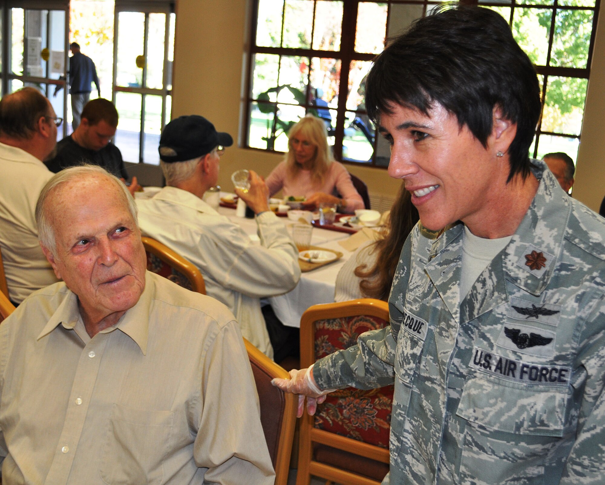TRAVIS AIR FORCE BASE, Calif. -- Airmen from the 349th Air Mobility Wing "Give Thanks' by serving dinner to these veterans who have paved the way for the military we have today. Along with their friends and family, they share fellowship and a scrumptious turkey dinner with the men and women who, happily, shared there military stories and experiences.  (U.S. Air Force photo / Senior Master Sgt. Ellen Hatfield) 