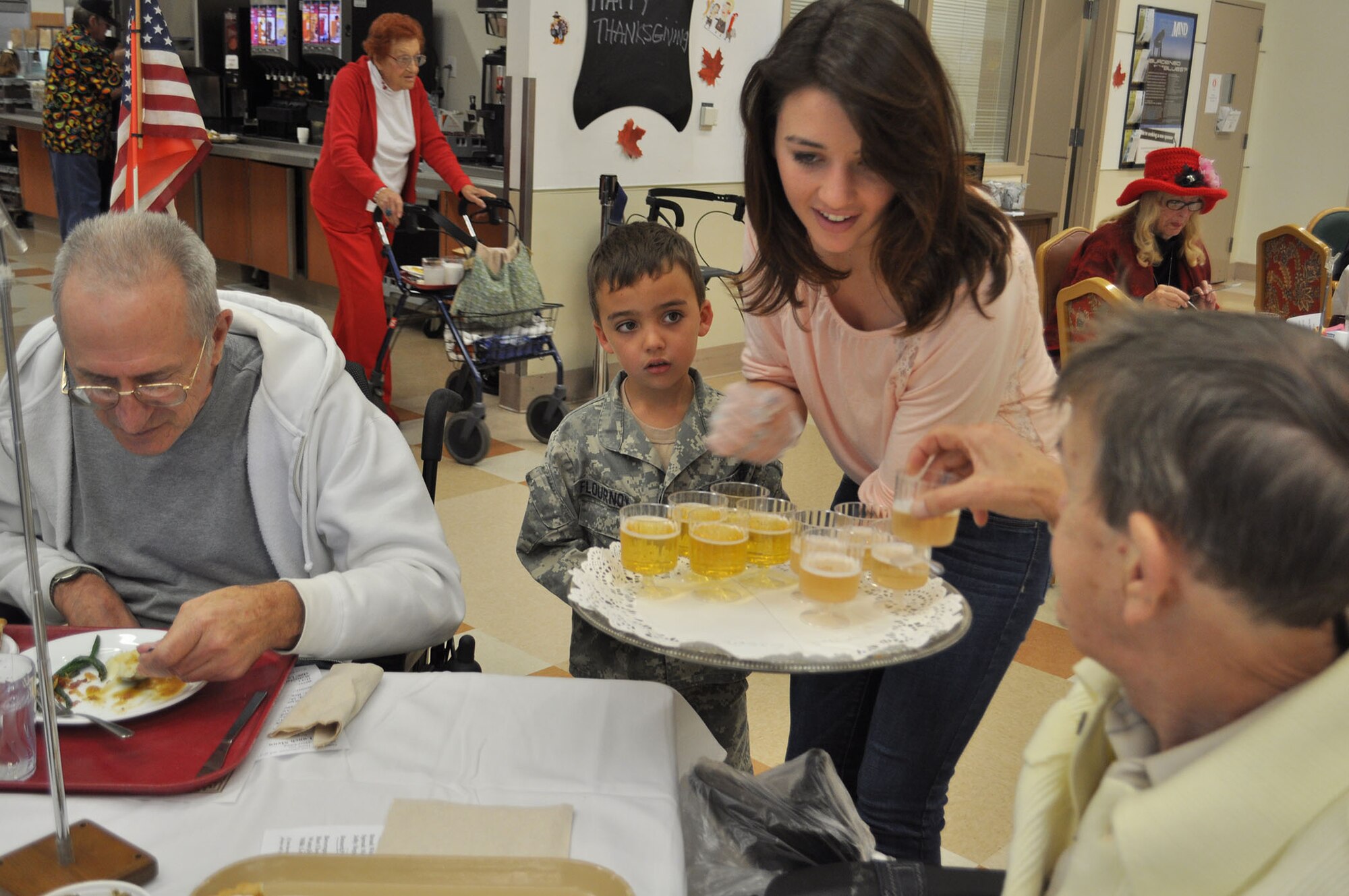 TRAVIS AIR FORCE BASE, Calif. -- Airmen from the 349th Air Mobility Wing "Give Thanks' by serving dinner to these veterans who have paved the way for the military we have today. Along with their friends and family, they share fellowship and a scrumptious turkey dinner with the men and women who, happily, shared there military stories and experiences.  (U.S. Air Force photo / Senior Master Sgt. Ellen Hatfield) 