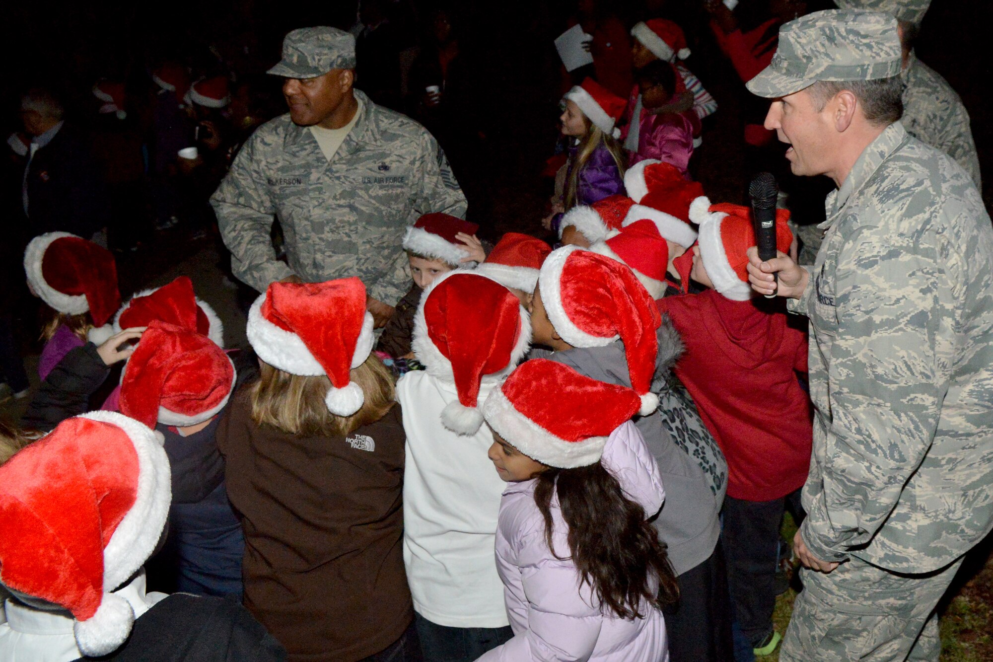 U.S. Air Force Col. Clay Hall, 20th Fighter Wing commander, and chief Master Sgt. James Wilkerson, 20th Fighter Wing command chief, count down for the Shaw Christmas tree lighting at memorial lake, Shaw Air Force Base, S.C. Nov. 29, 2012. The celebration attracted more than 300 participants. (U.S. Air Force photo by Airman 1st Class Ashley L. Gardner/ Released)


