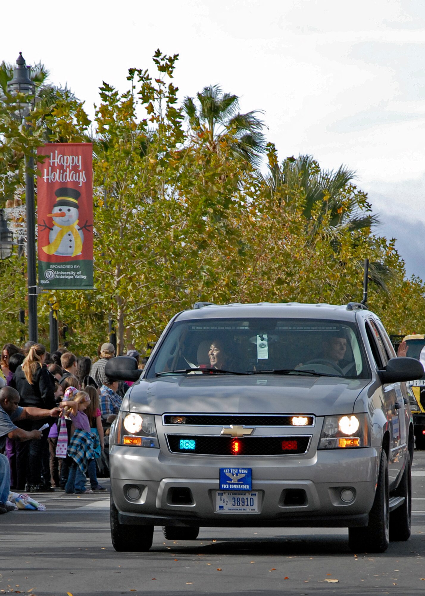 Col. Daniel Daetz, 412th Test Wing vice commander, waves to the crowd during the annual Lancaster Christmas/Holiday Parade Dec. 1.  (U.S. Air Force photo by Laura Mowry)