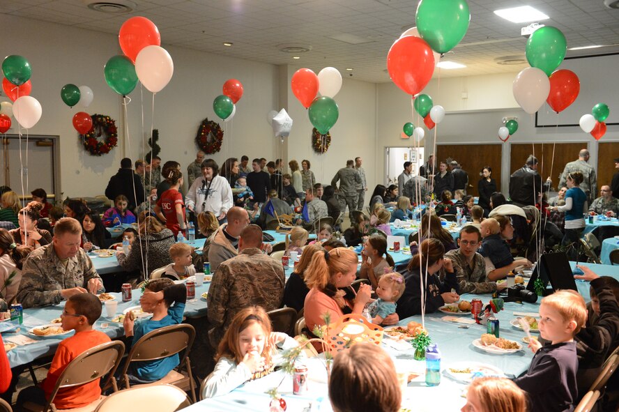 Dozens of family members of deployed Airmen are treated to a holiday dinner, Dec. 3, 2012, at Joint Base Lewis-McChord. The event, which took place at the McChord Field Chapel Annex, was to honor the families of the more than 270 deployed Airmen of the 62nd Airlift Wing. (U.S. Air Force photo/Staff Sgt. Sean Tobin)
