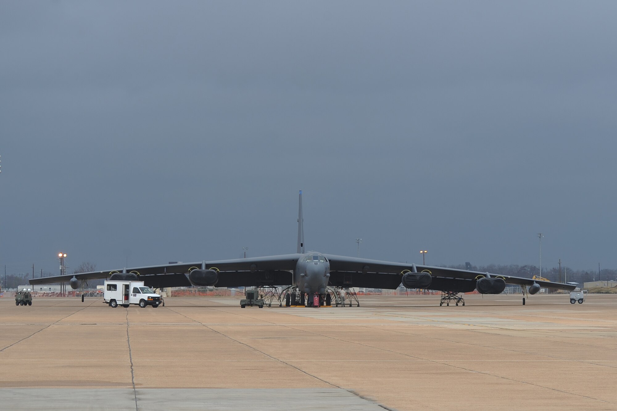 Airmen from the 2nd Maintenance Squadron work on a B-52H Stratofortress as storm clouds approach on Barksdale Air Force Base, La., Dec. 4. The B-52's dark grey color helps the aircraft blend in when flying at higher altitudes, at night or over large bodies of water. (U.S. Air Force photo/Senior Airman Micaiah Anthony)