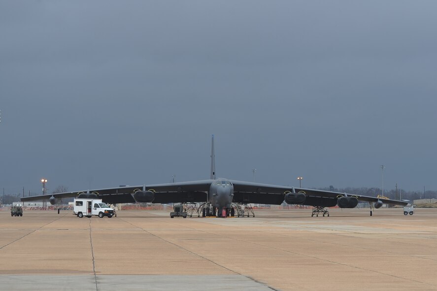 Airmen from the 2nd Maintenance Squadron work on a B-52H Stratofortress as storm clouds approach on Barksdale Air Force Base, La., Dec. 4. The B-52's dark grey color helps the aircraft blend in when flying at higher altitudes, at night or over large bodies of water. (U.S. Air Force photo/Senior Airman Micaiah Anthony)