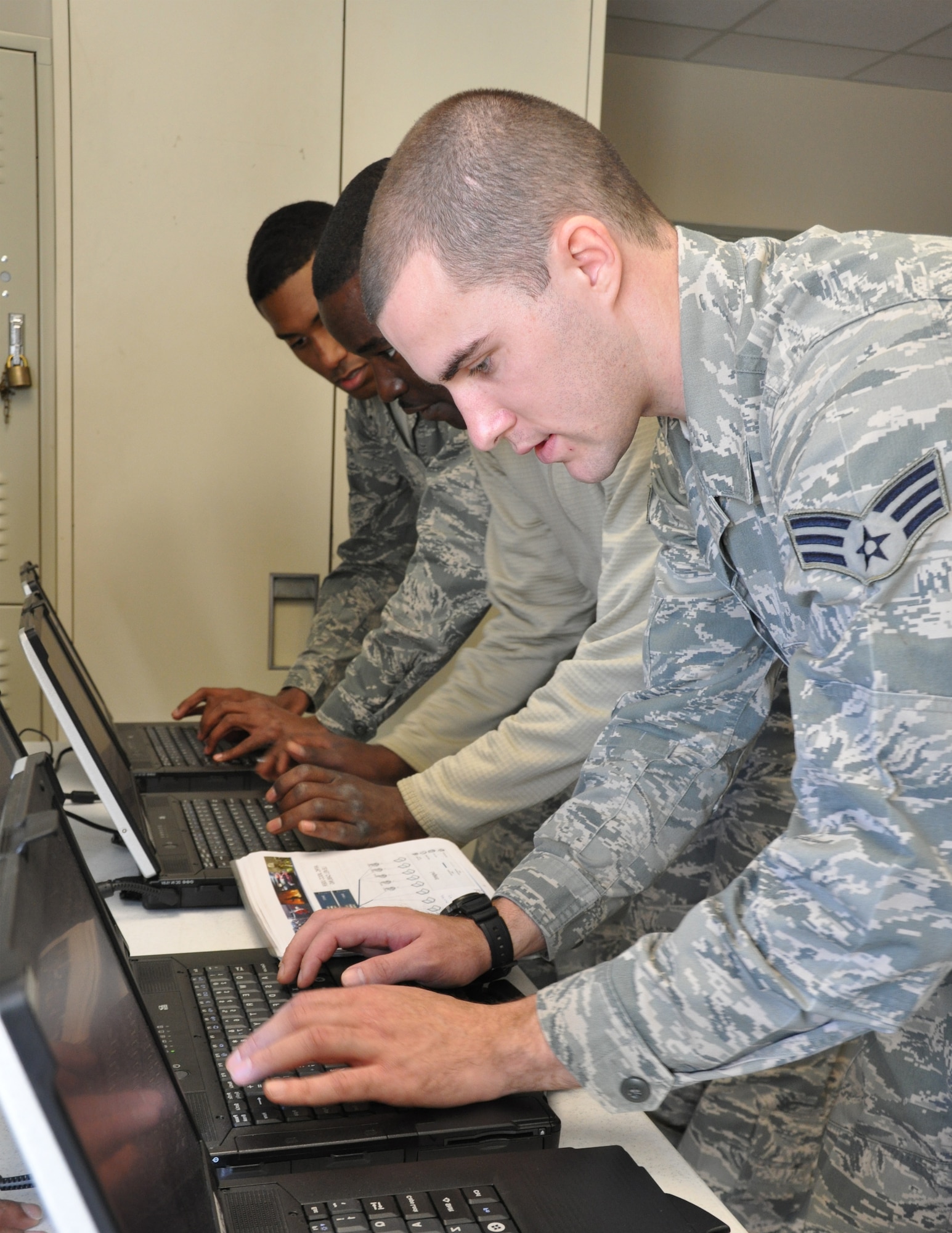 Senior Airmen Thomas Roland, Chadwick Brigham and Ali Shekey, of the 94th Communications Squadron, receive and process data using the Joint Incident Site Communication Capability. The squadron maintains the capability of deploying the JISCC with 48 to 72 hours notice. (U.S. Air Force photo/Senior Airman Christina Bozeman)