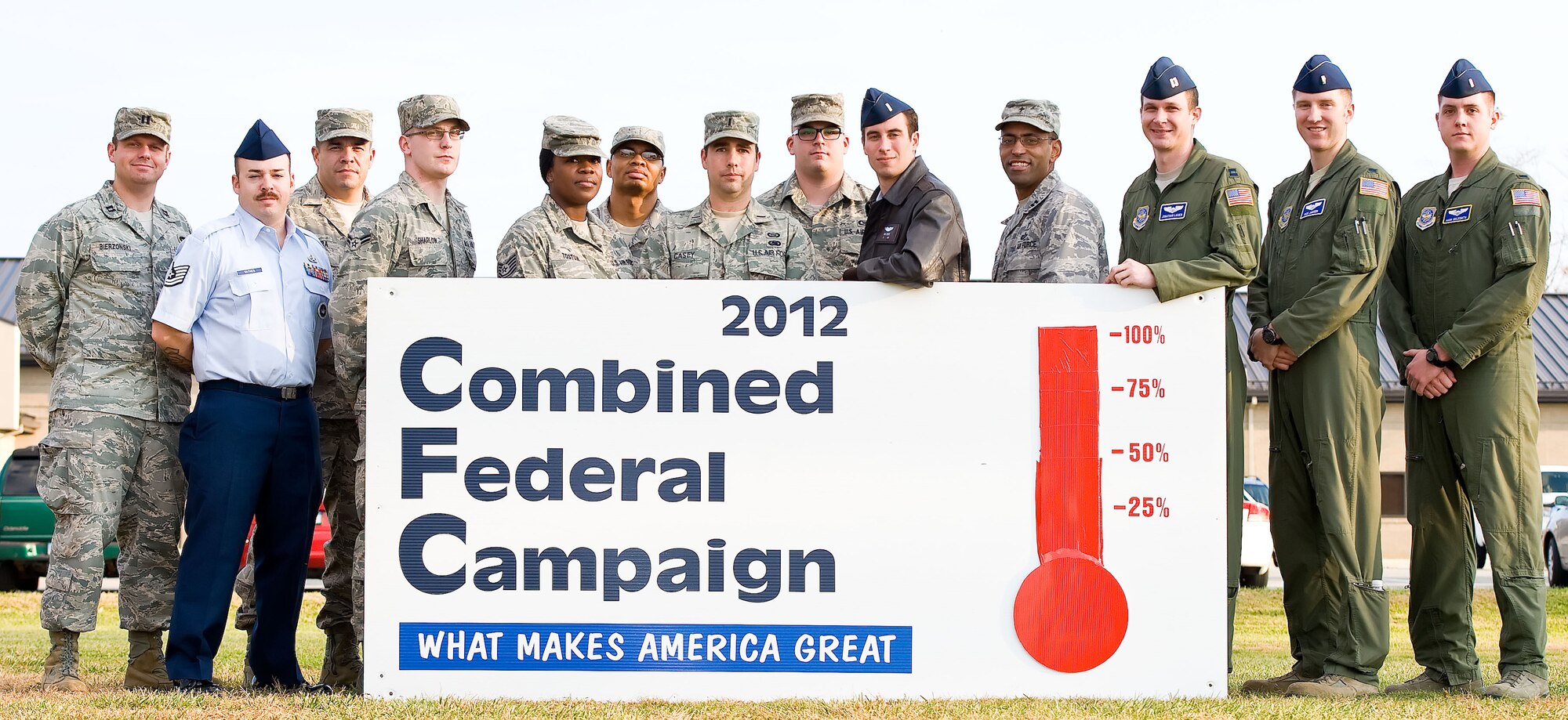 Unit representatives for the 2012 Combined Federal Campaign pose for a photo Dec. 3, 2012, at Dover Air Force Base, Del. Capt. Jonathan Lauer, third from left, CFC installation representative, reported that Team Dover donated $186,782.17, approximately 104 percent of the base's goal this year. (U.S. Air Force photo by Roland Balik)
