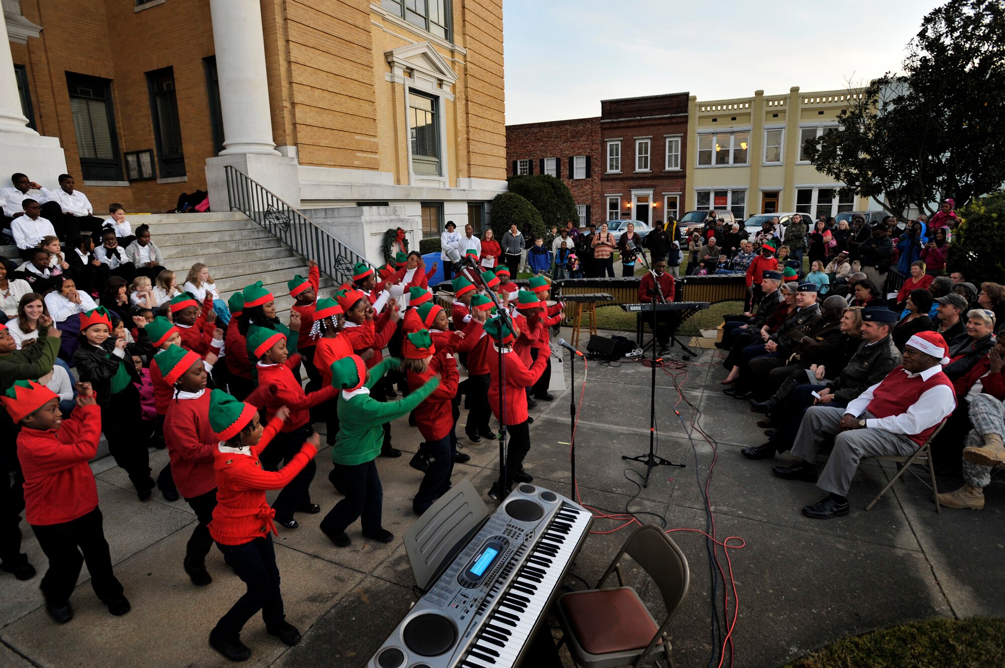 Children from Lemira Elementary School choir, perform in front of the Sumter County Courthouse during the Sumter County Council Christmas Tree Lighting Ceremony, Nov. 30, 2012, Sumter S.C. The annual ceremony brought about the holiday spirit as several elementary, junior high, and high school choirs performed Christmas carols for those who gathered at the courthouse to witness the celebration. (U.S. Air Force photo by Staff Sgt. Kenny Holston/Released)