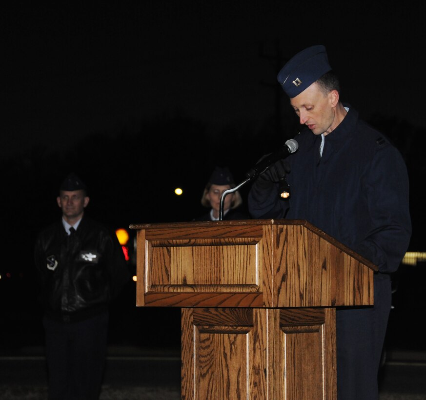 Capt. Mark Hunsinger, Protestant chaplain, reads the meaning of Christmas to attendees of the Christmas Tree and Menorah Lighting Ceremony at Chapel One  Nov. 29, 2012. The lighting of the tree and menorah is an annual event that consists of singing, menorah and tree lighting, prayer and a visit from Santa and Mrs. Claus. (U.S. Air Force photo/Airman 1st Class Erin O’Shea) 