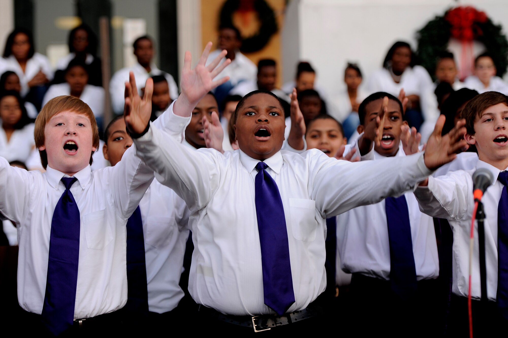 Junior High choir students, perform in front of the Sumter County Courthouse during the Sumter County Council Christmas Tree Lighting Ceremony, Nov. 30, 2012, Sumter S.C. The annual ceremony brought about the holiday spirit as several elementary, junior high, and high school choirs performed Christmas carols for those who gathered at the courthouse to witness the celebration. (U.S. Air Force photo by Staff Sgt. Kenny Holston/Released)