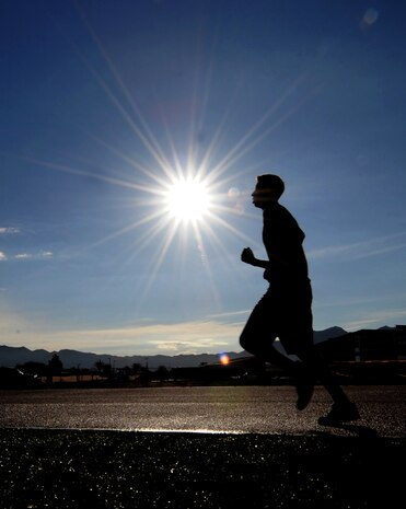 A runner uses the track at the Warrior Fitness Center Oct. 12 , 2012, at Nellis Air Force Base, Nev. Running on a track is preferred, but those who run on a road should do so facing traffic. (U.S. Air Force photo by Staff Sgt. William P. Coleman)  